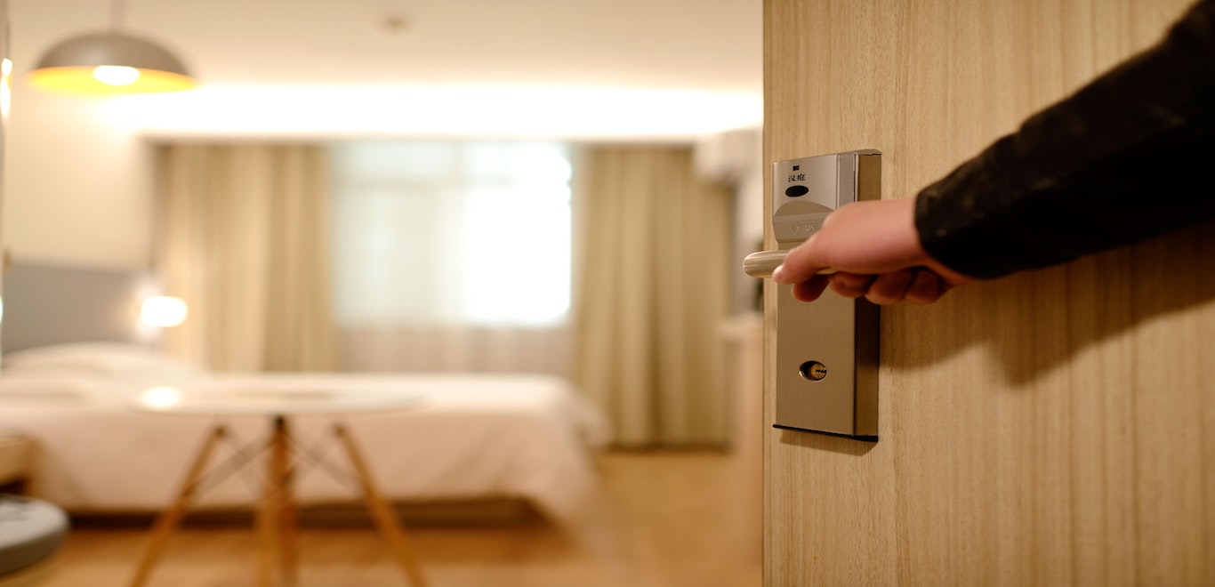 Businessman opening door to hotel room