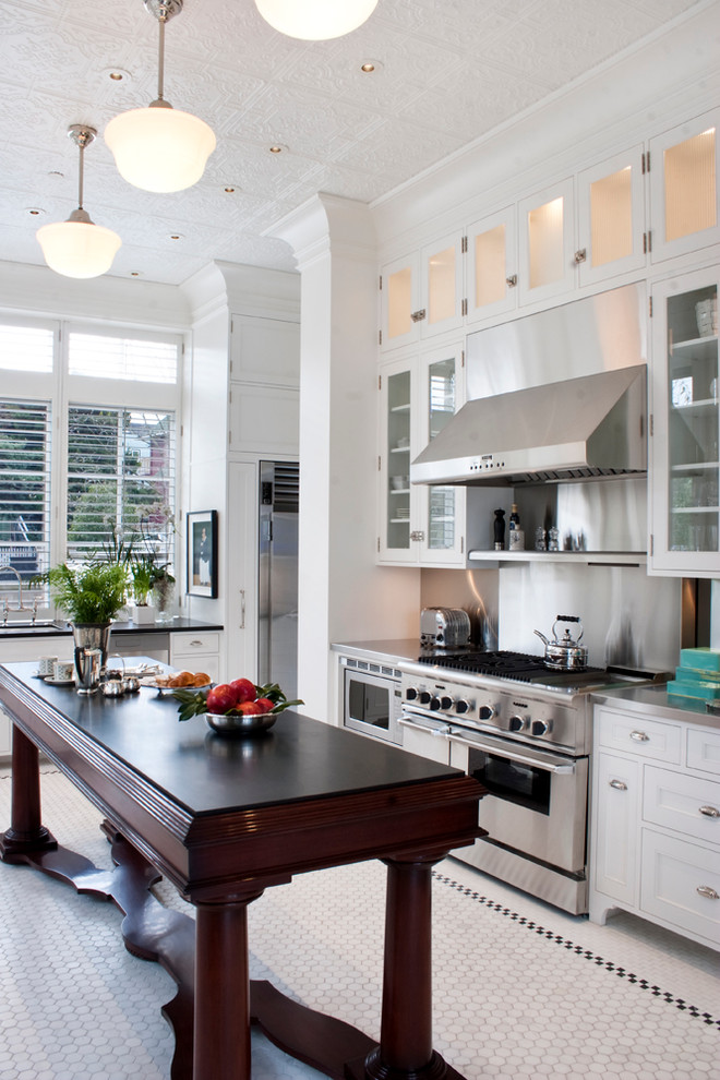 Narrow kitchen with small floor tiles