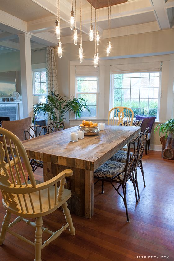 Lightbulb chandeliers over the dining table