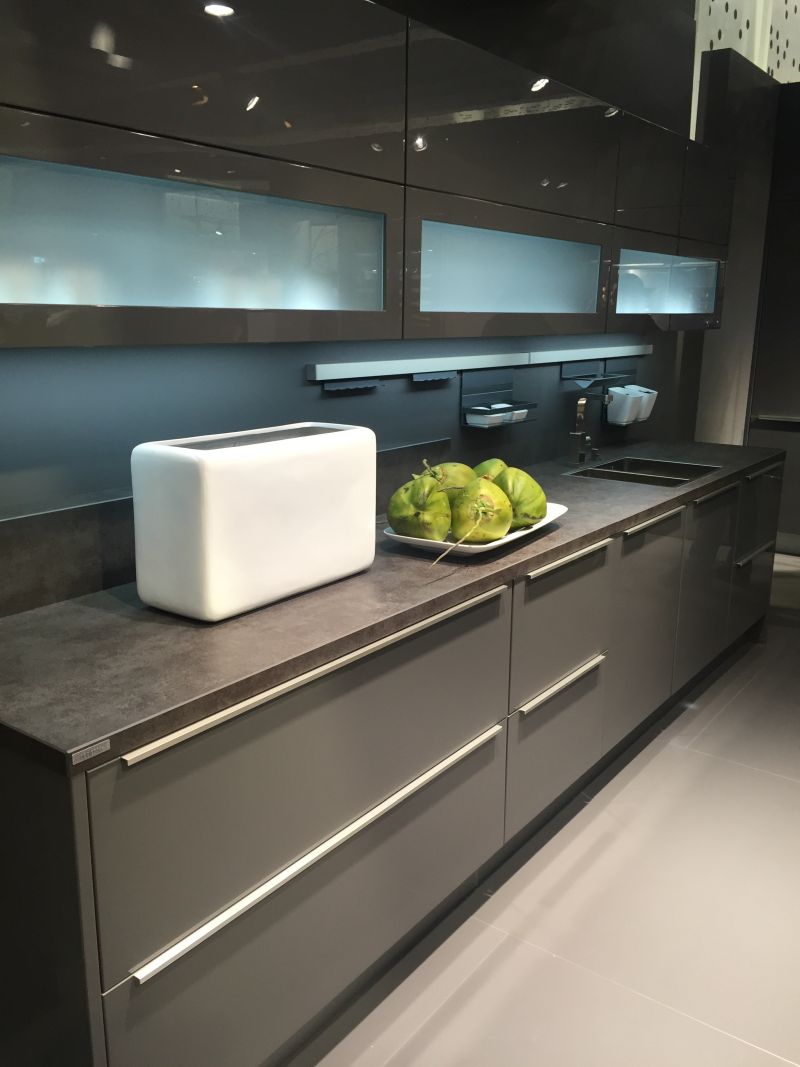 Gray kitchen design with glass cupboard doors