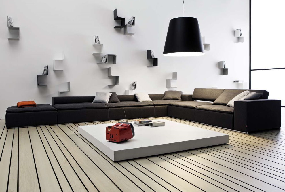 Низкий угловой диван в гостиной стиля минимализм