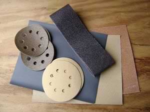 photo of various types of sandpaper and abrasives
