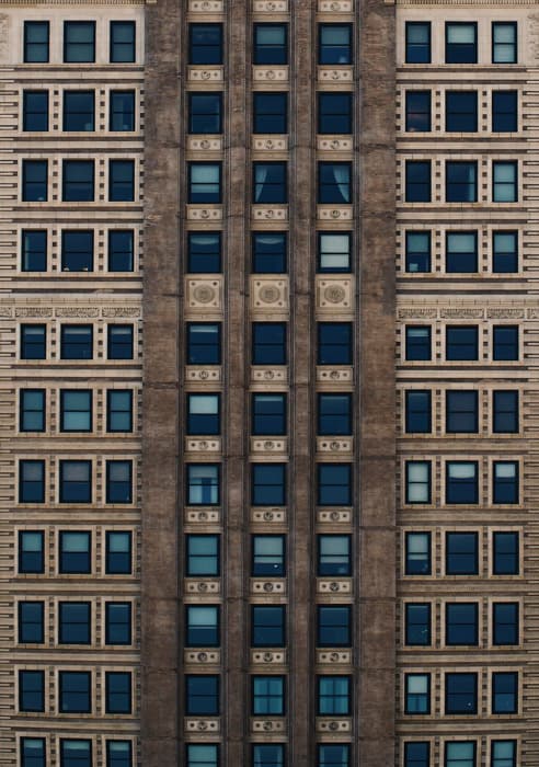 Cool perspective photography shot of a multi windowed building 