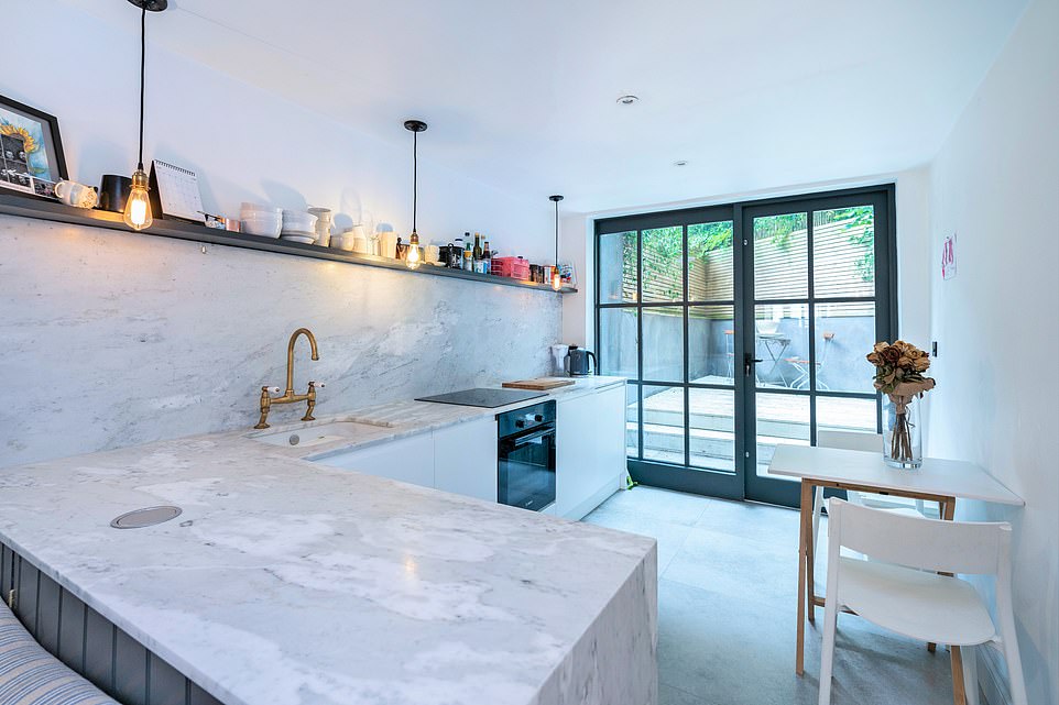 The kitchen is decked out in marble surfaces while there is also a metro-tiled shower room and Crittall doors to the secluded rear garden