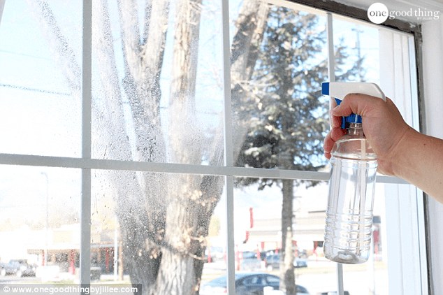 Next you can take your spray bottle and spray the surface of your window with water 