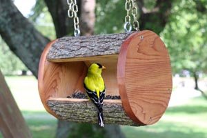 DIY homemade wooden bird feeder plans using a recycled or natural log.