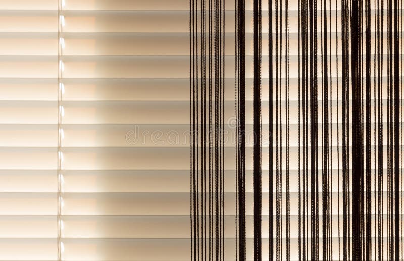 Beige blinds and curtains rope royalty free stock photos