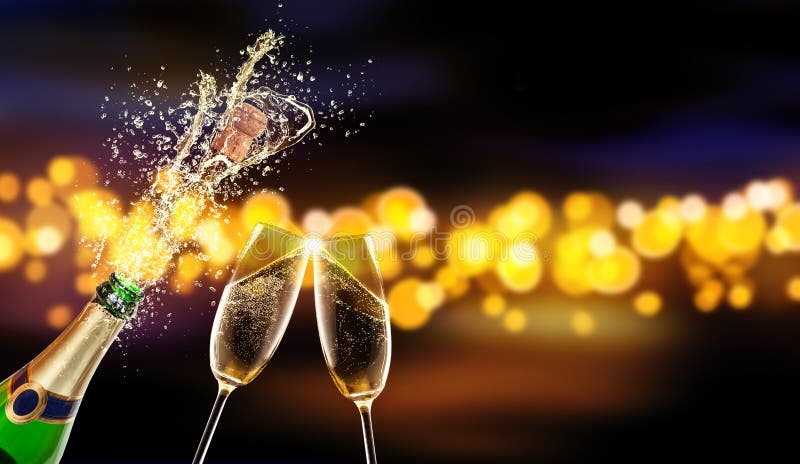 Bottle of champagne with glass over blur background royalty free stock photos