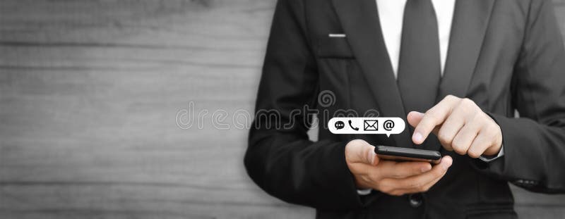 Businessman hand holding smartphone with icon mobile phone, and email address. royalty free stock images