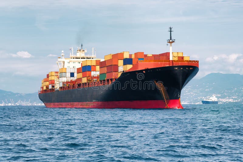 Cargo ship full of containers stock images