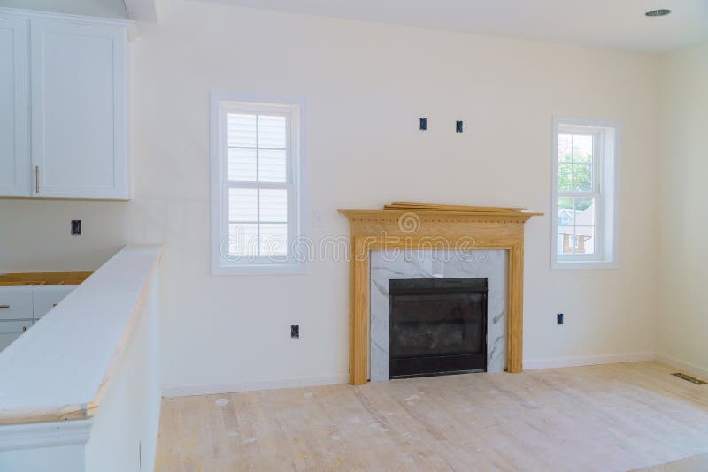Empty spacious living room with fireplace new apartment stock image