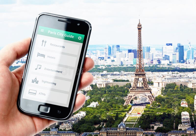 Hand holding smartphone with city guide in Paris stock image