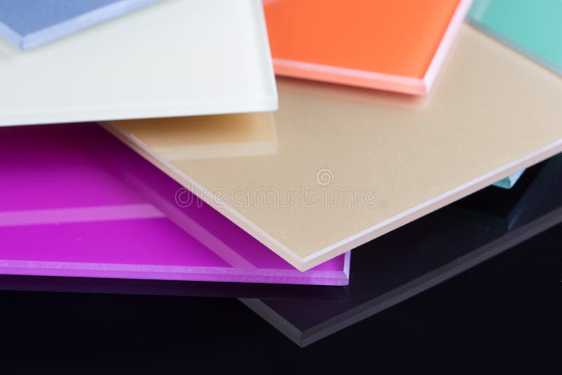 A stack of colored glass on a black background royalty free stock photo