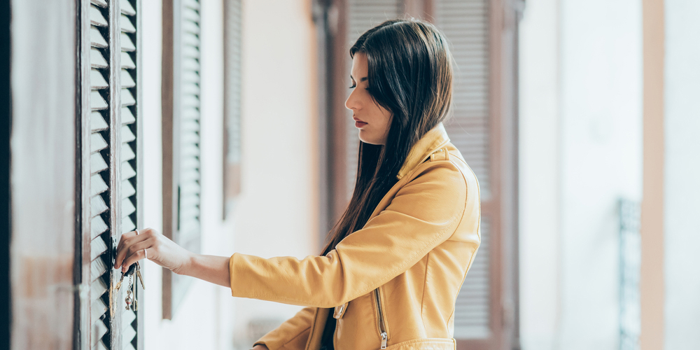 Girl Locking Front Door