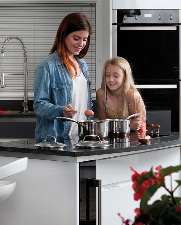 family-cooking-on-electric-hob