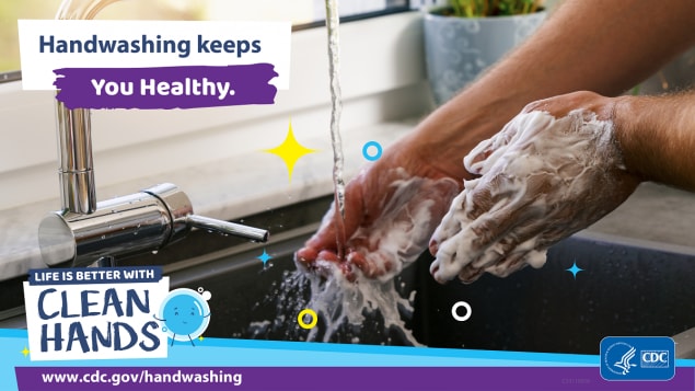 Close-up of hands being washed in the kitchen and a reminder that handwashing keeps you healthy.