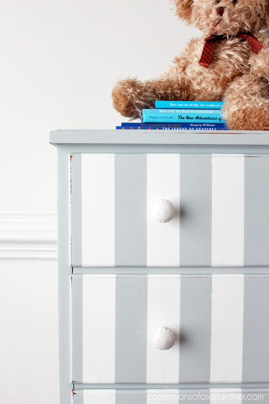 Dated dresser updated with gray stripes from confessionsofaserialdiyer.com