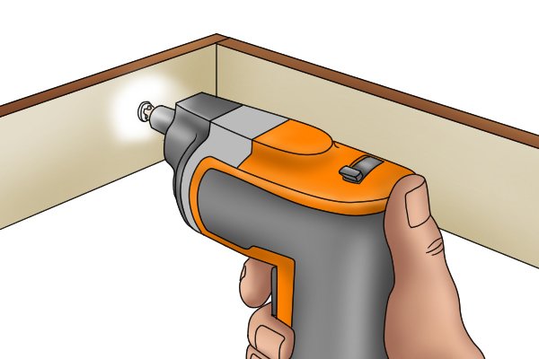 Cordless screwdriver being used in a confined space